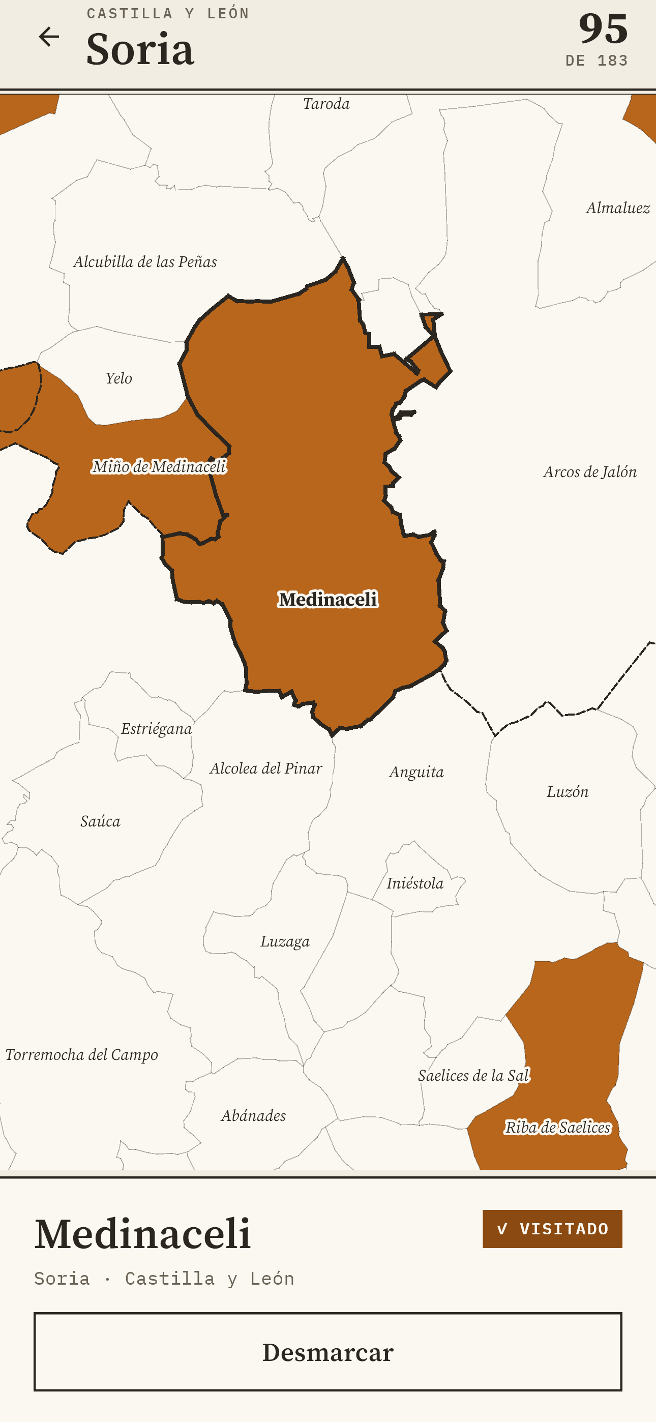 Pueblario on a phone: the province of Soria zoomed in, with 95 of its 183 municipalities marked and the card for Medinaceli, visited, open.